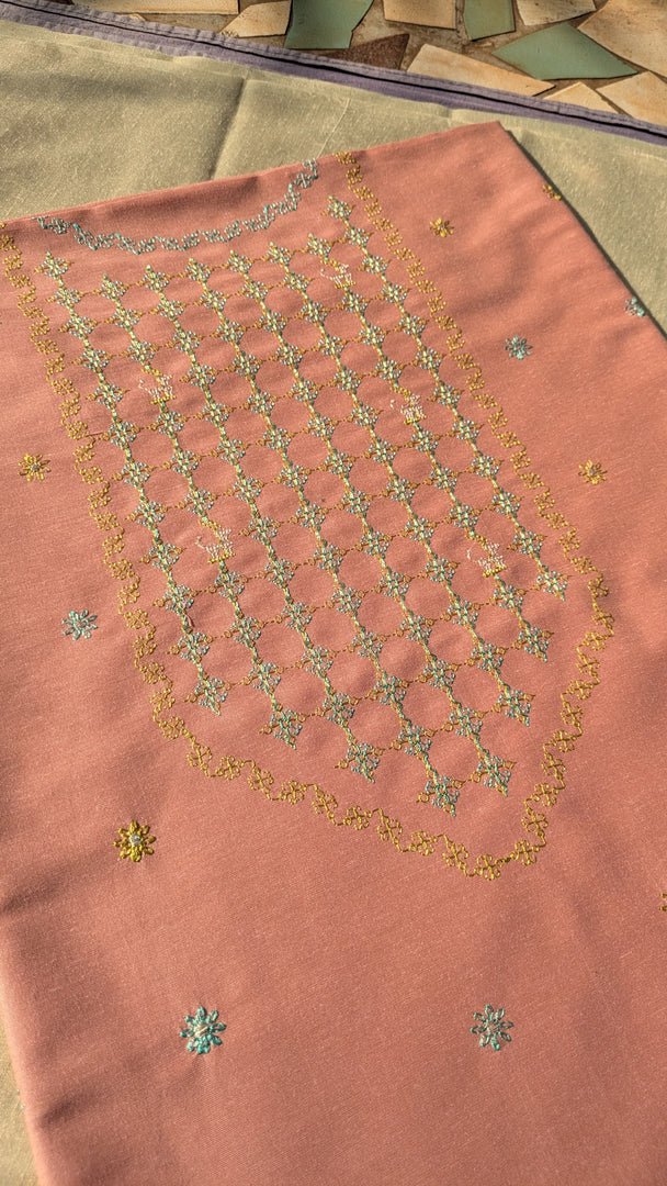 jinki kurta material in peach shade flat-lay fabric
