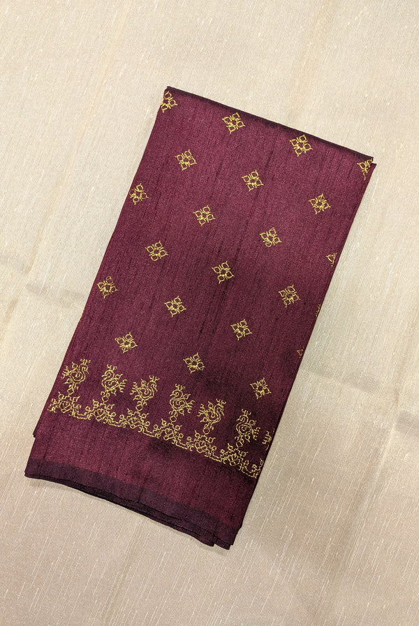 maroon blouse showing gold zari kasuti embroidery with peacock motif