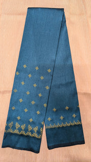 neeli blue blouse showing kasuti embroidery with peacock gold zari