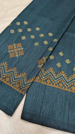 Load image into Gallery viewer, Side angled view of deep green blouse showing kasuti motifs
