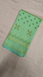 Load image into Gallery viewer, Angled side of parrot green blouse featuring kasuti embroidery
