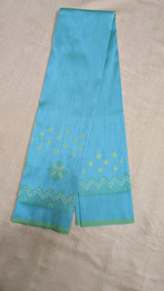 Blue kasuti blouse front view with embroidered neckline detail