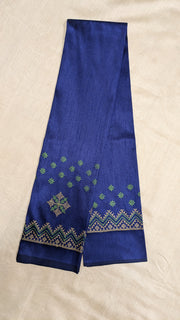 Embroidery close-up on navy blue kasuti blouse neckline