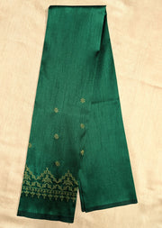 Deep green blouse angled side showing kasuti work on neckline