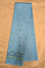 Load image into Gallery viewer, Angled view of sky blue blouse showing kasuti neckline work
