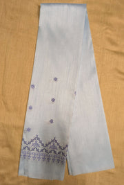 Embroidery close-up on grey kasuti blouse fabric