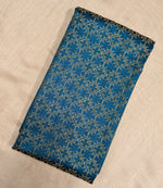 Load image into Gallery viewer, Angled view of blue kasuti bloom blouse showing kasuti stitchwork
