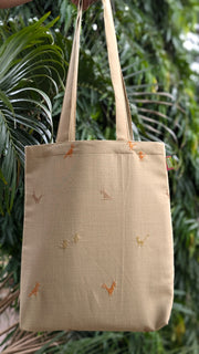 Beige kasuti farm animals tote bag side angle showing embroidery detail