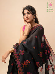 Close-up of black kasuti saree showcasing embroidered floral patterns