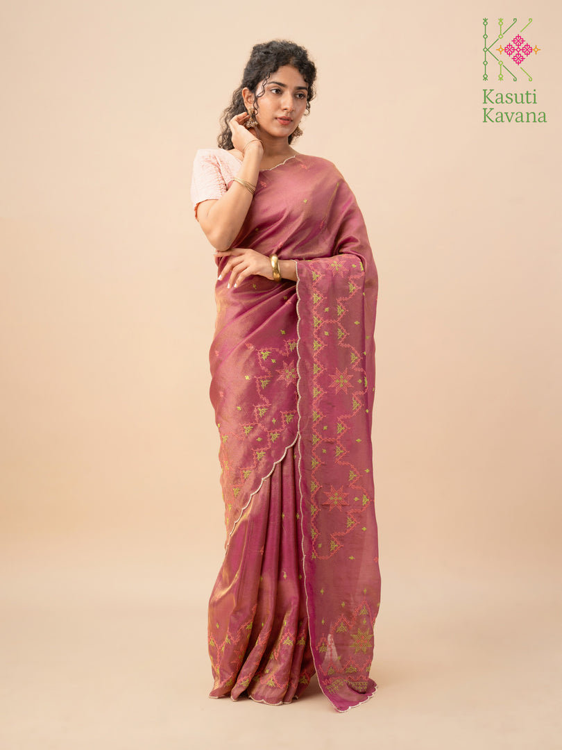 Pallu close-up of deep pink tissue saree with kasuti temple motifs
