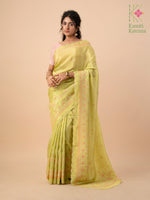 Load image into Gallery viewer, embroidered kasuti temple tissue saree in light green close-up
