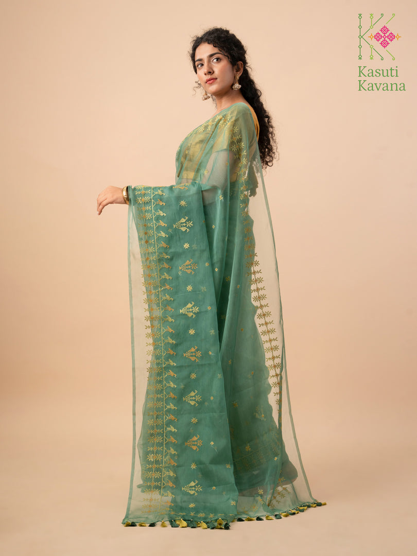 green mayur organza kasuti saree highlighting woven embroidery detail