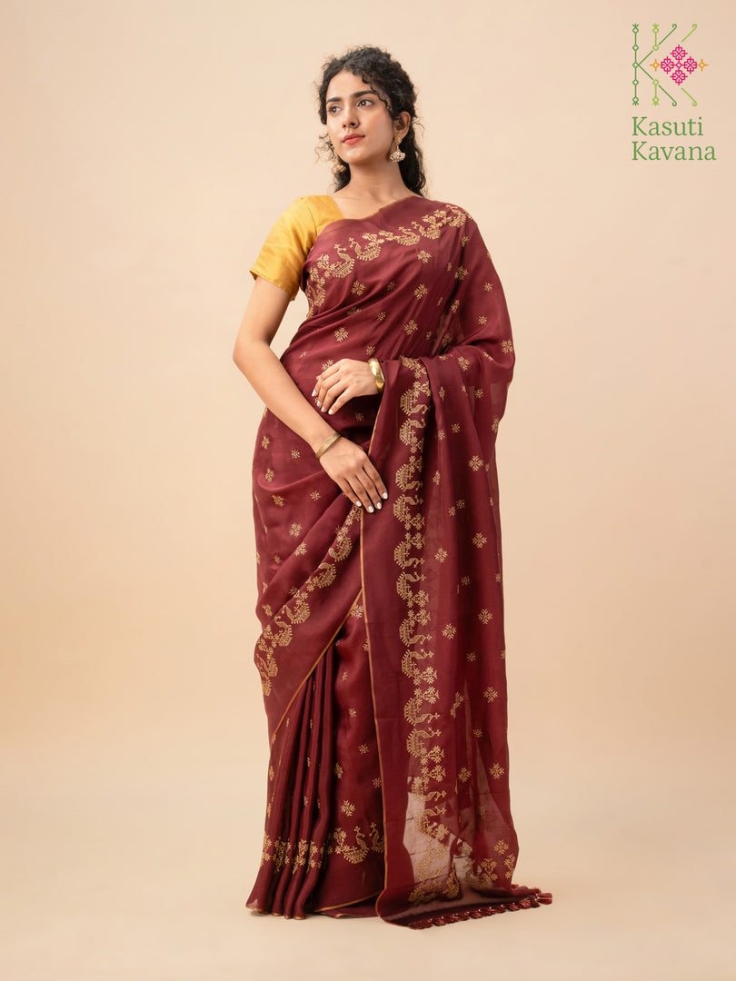 Ruby saree with goose motifs and decorative golden pallu border