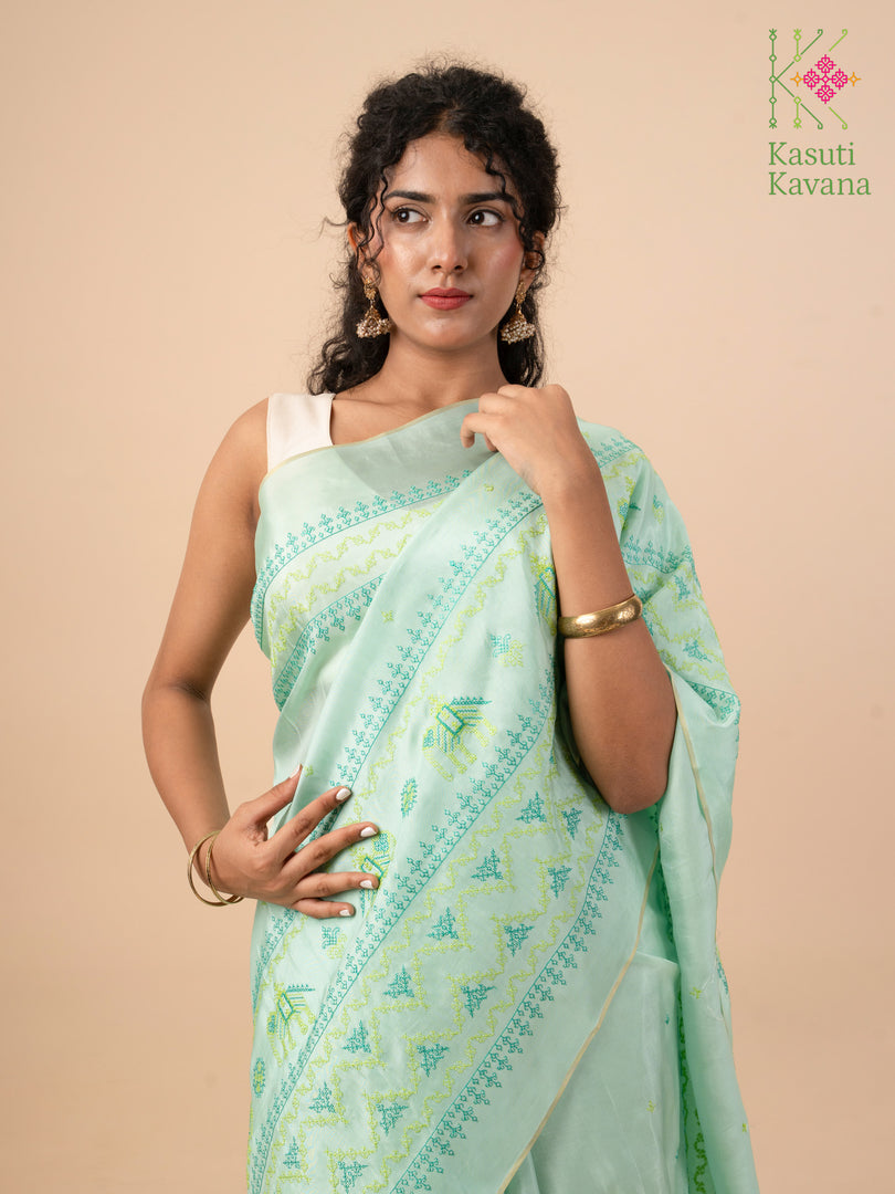 embroidered elephant motif saree in elaichi pista shade close-up