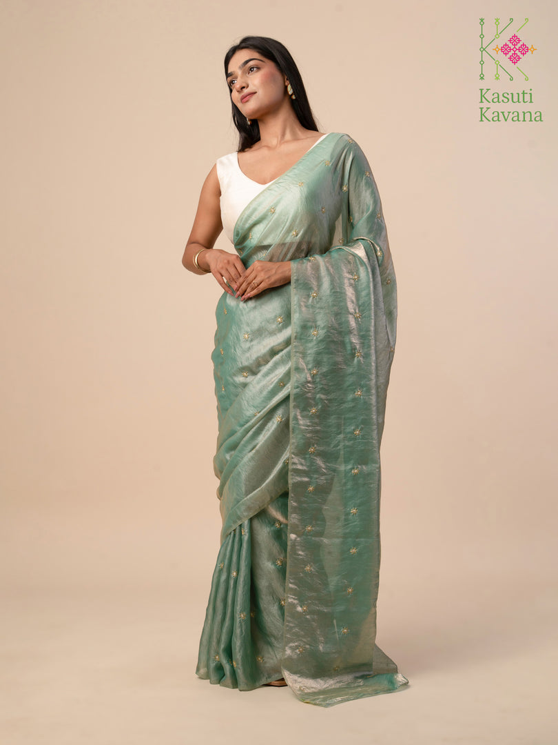 jade flora organza saree with jade green fabric and embroidery close-up