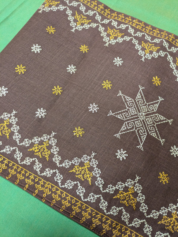 brown wildflower table runner with floral pattern close-up view
