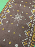 Load image into Gallery viewer, brown wildflower table runner with floral embroidered border detail
