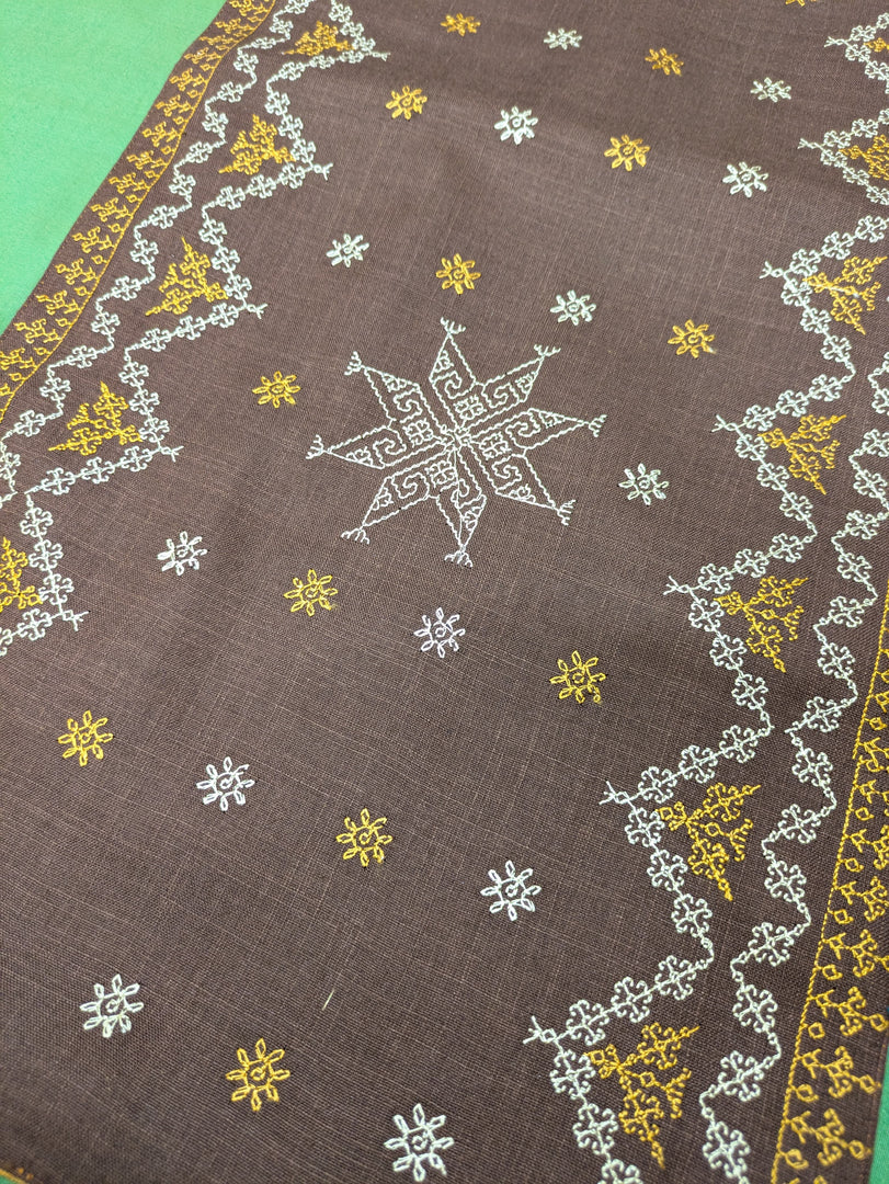 brown wildflower table runner with floral embroidered border detail