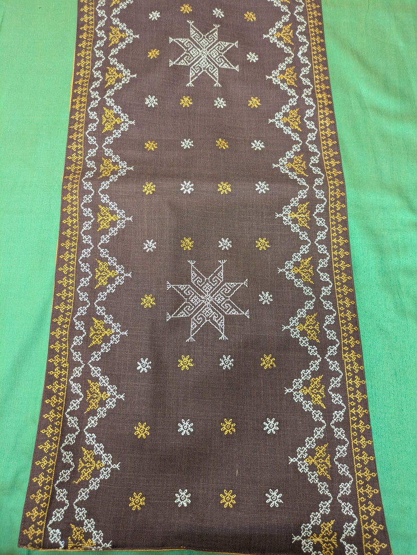 brown wildflower table runner showing embroidered wildflower motifs