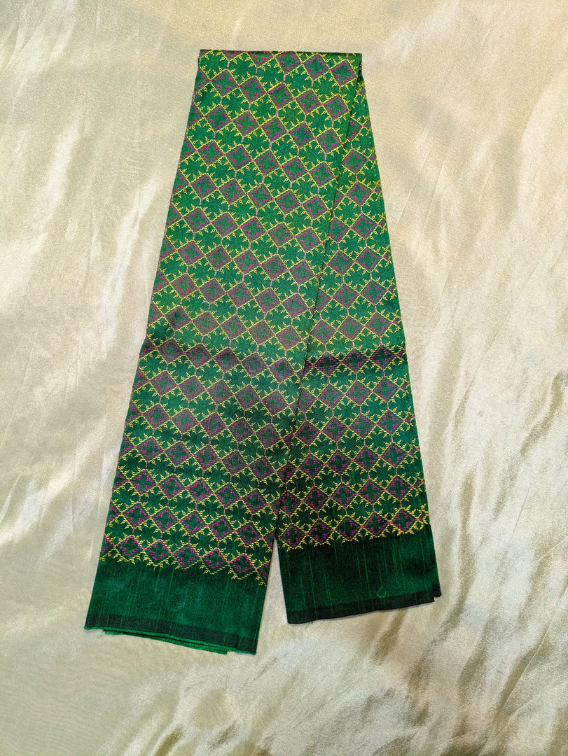 back design of deep green kasuti bloom blouse with floral embroidery