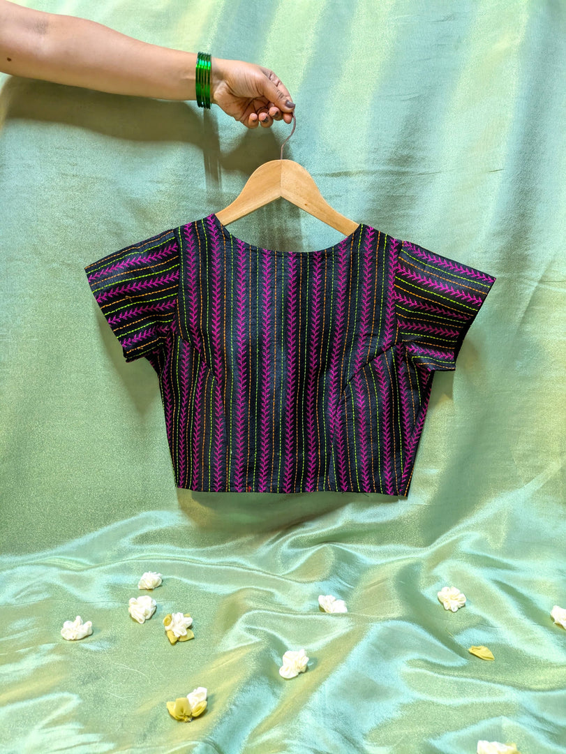 black kasuti stitched blouse with village motifs front neckline view