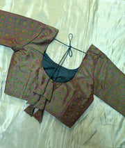 back design of deep mehendi chaya kasuti stitched blouse with embroidery