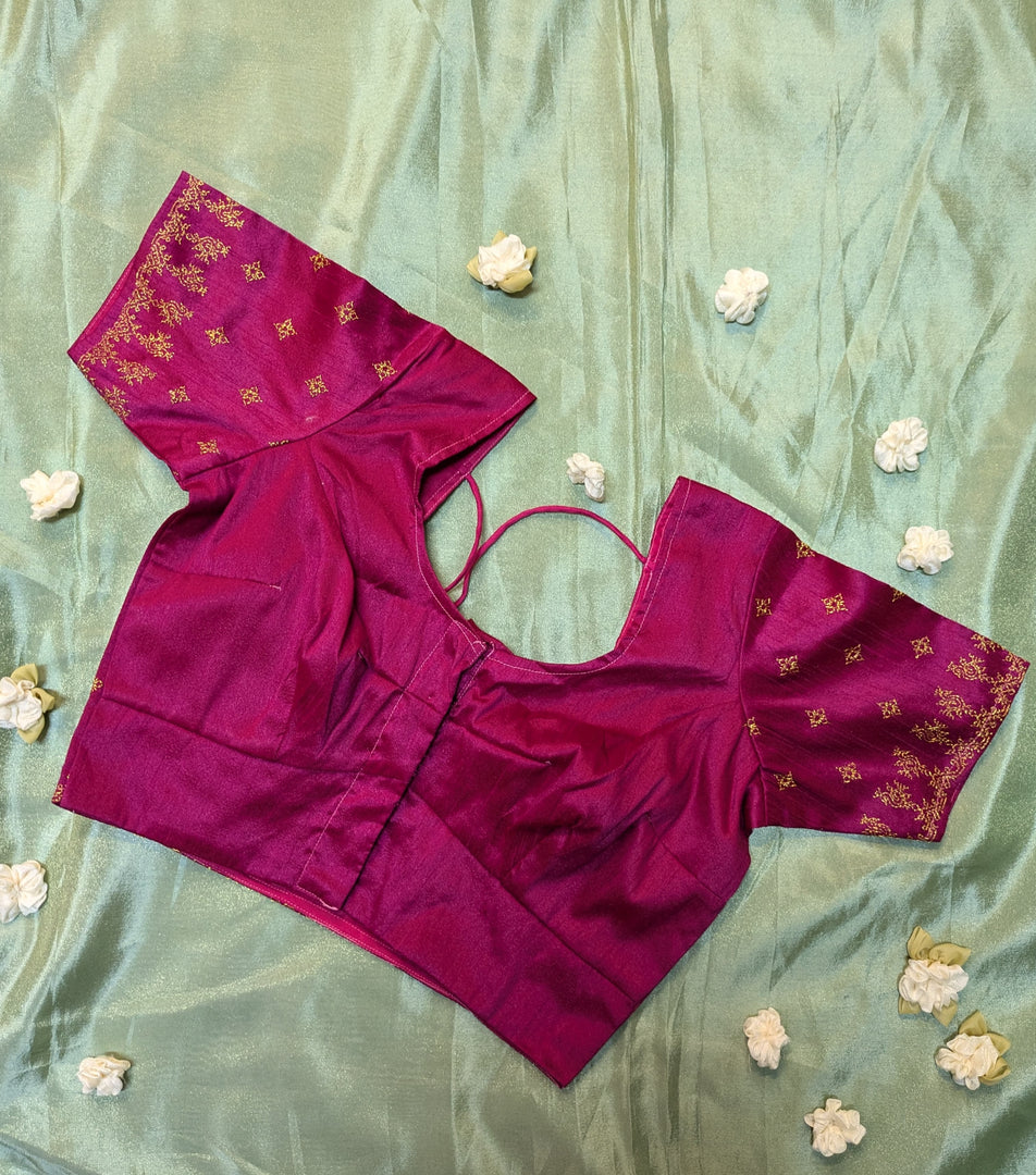 side view of pink peacock kasuti stitched blouse with embroidered neckline