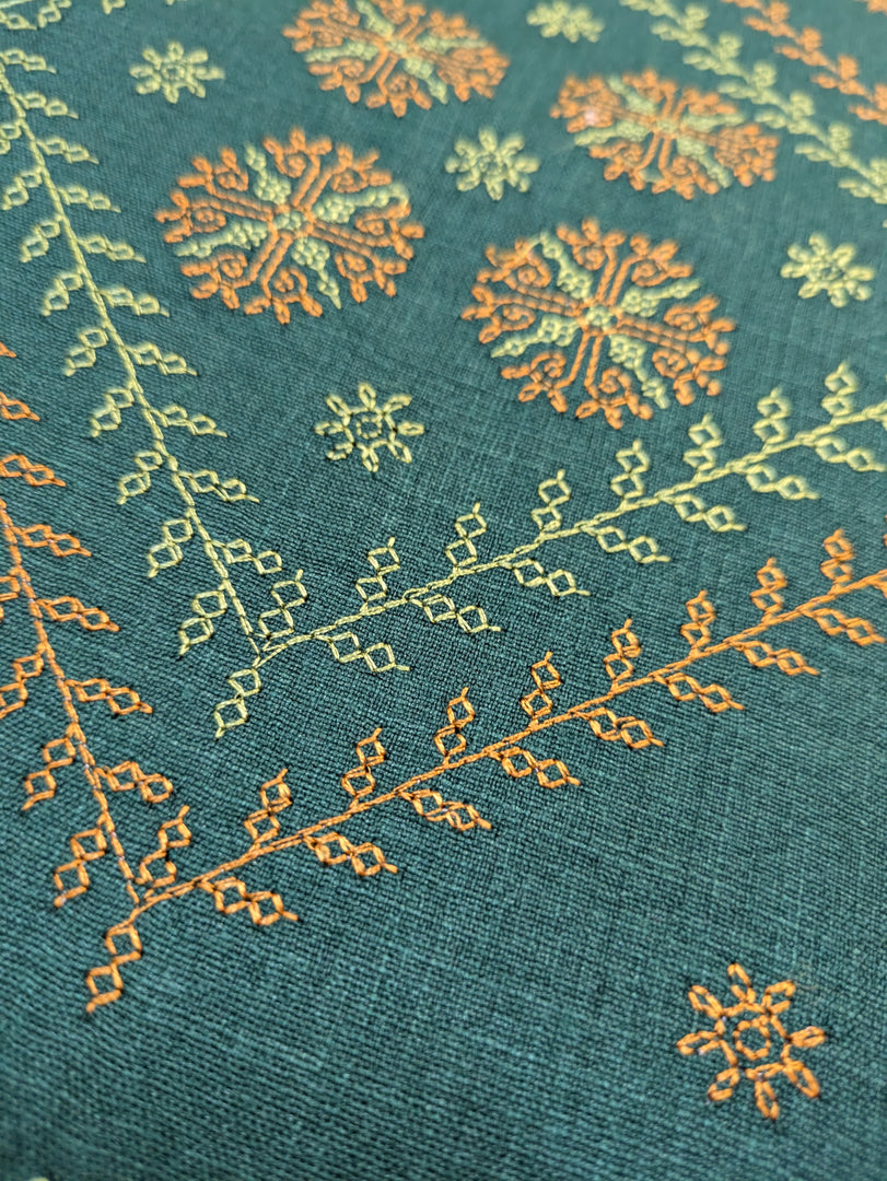 green wildflower table runner highlighting floral embroidery close-up