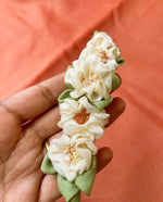 Load image into Gallery viewer, White handcrafted fabric gajra hairtie side view showing fabric flowers

