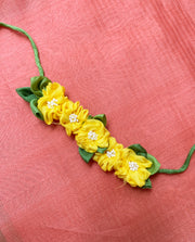 Lemon yellow handcrafted fabric gajra hairtie with fabric floral detail