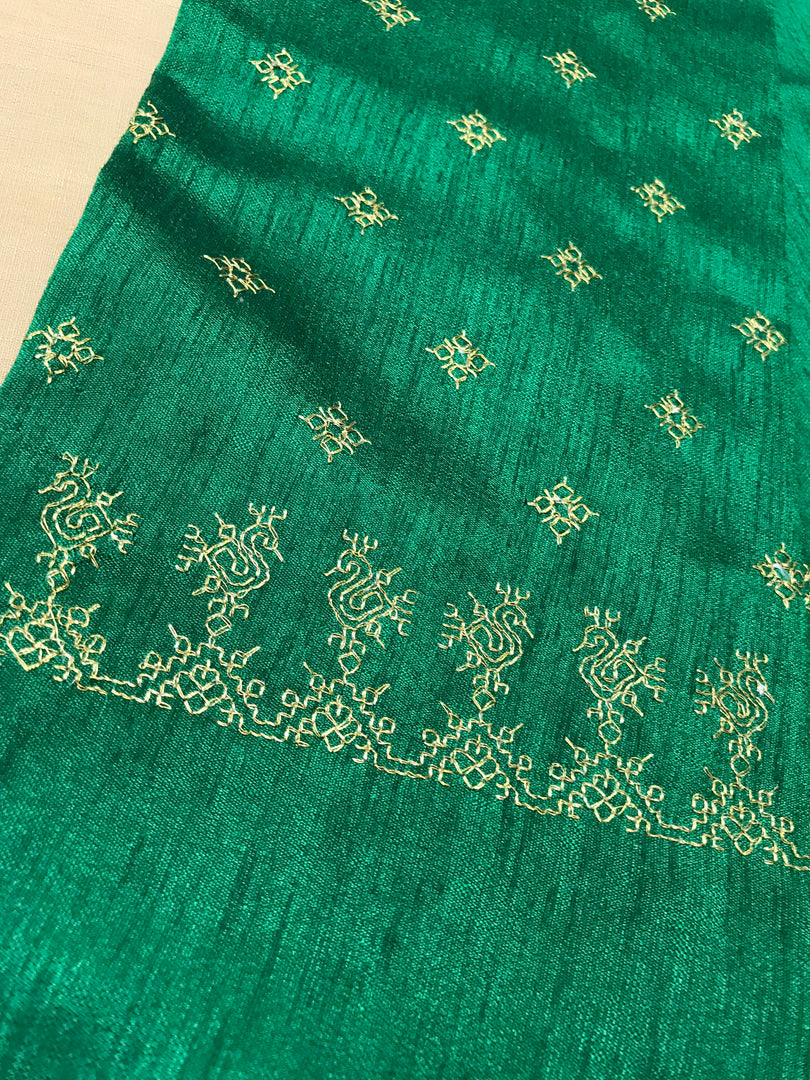 Green peacock kasuti blouse close-up highlighting embroidered peacock motifs