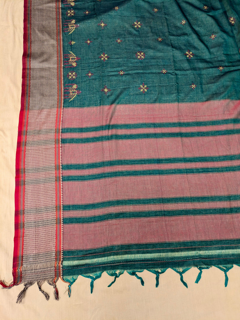 Green cotton saree highlighting aane kasuti motifs in close-up shot
